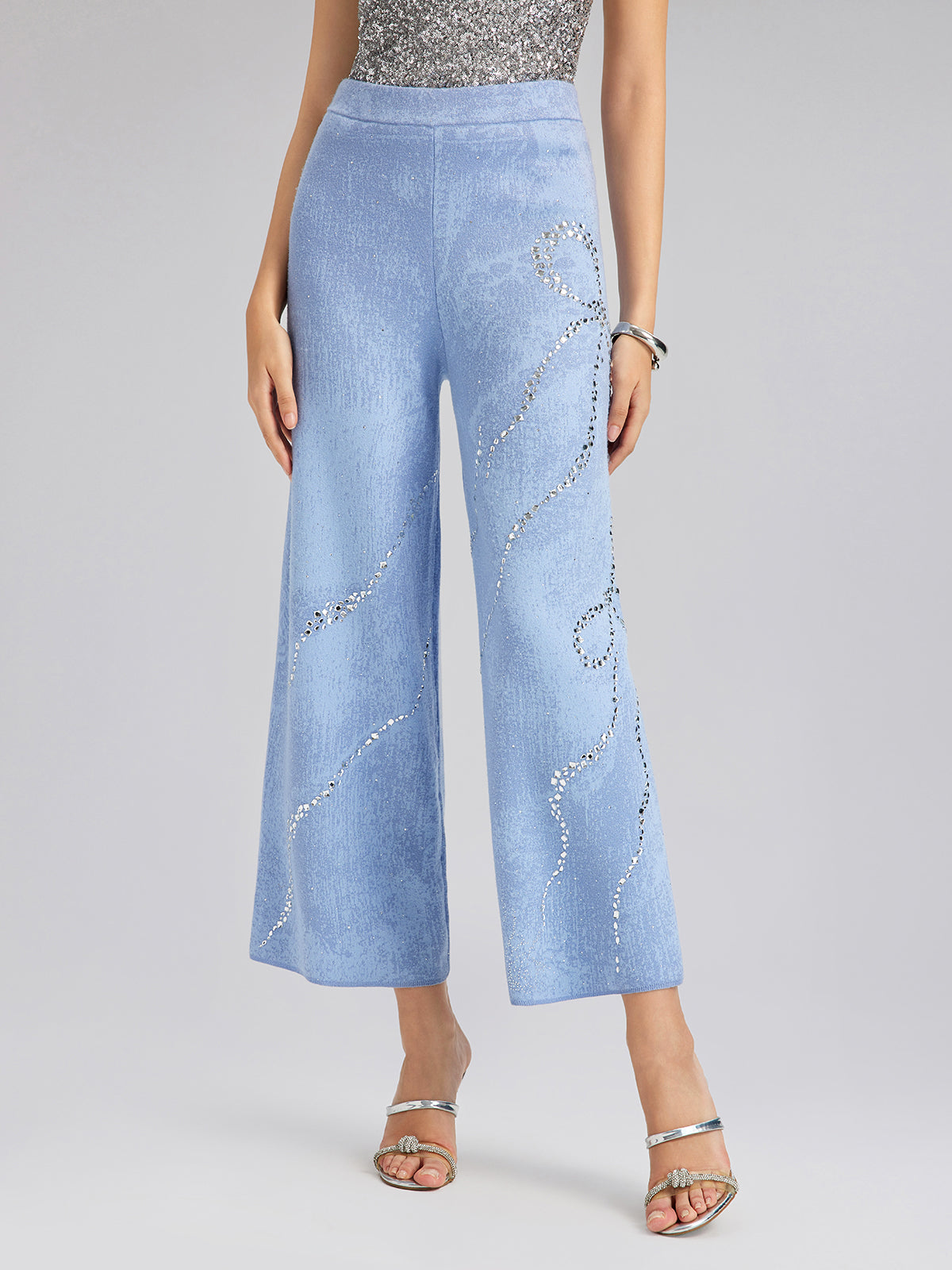 Pantalones elásticos de lana con pedrería